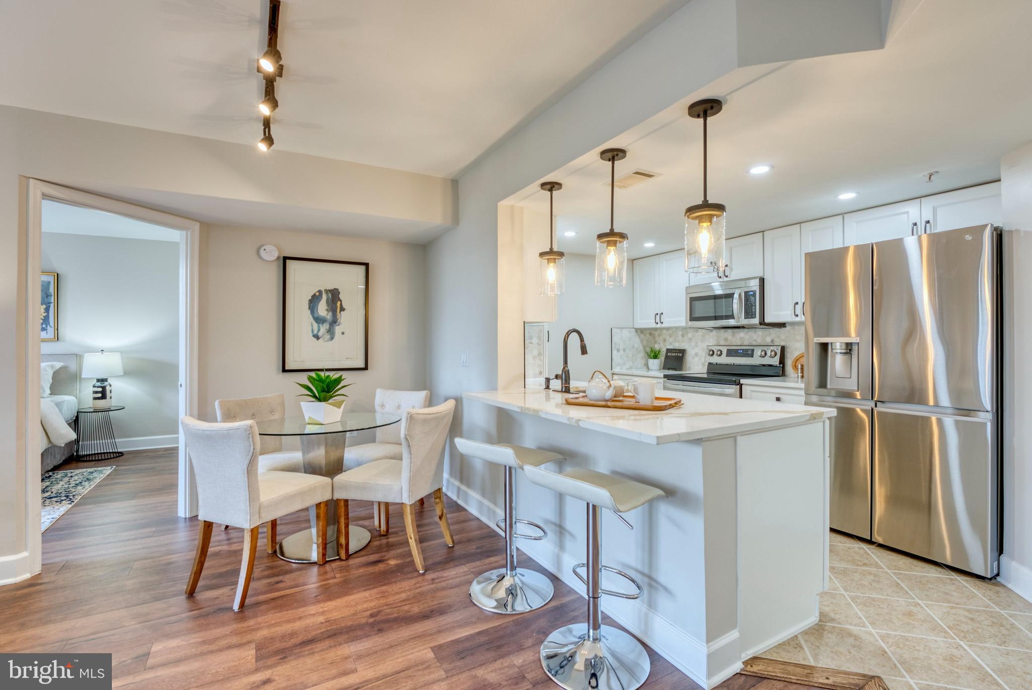 11800 Sunset Hills Road, Unit 913 Reston, VA 20190 - Photo 4 of 52 Dining Room & Counter Eating Space