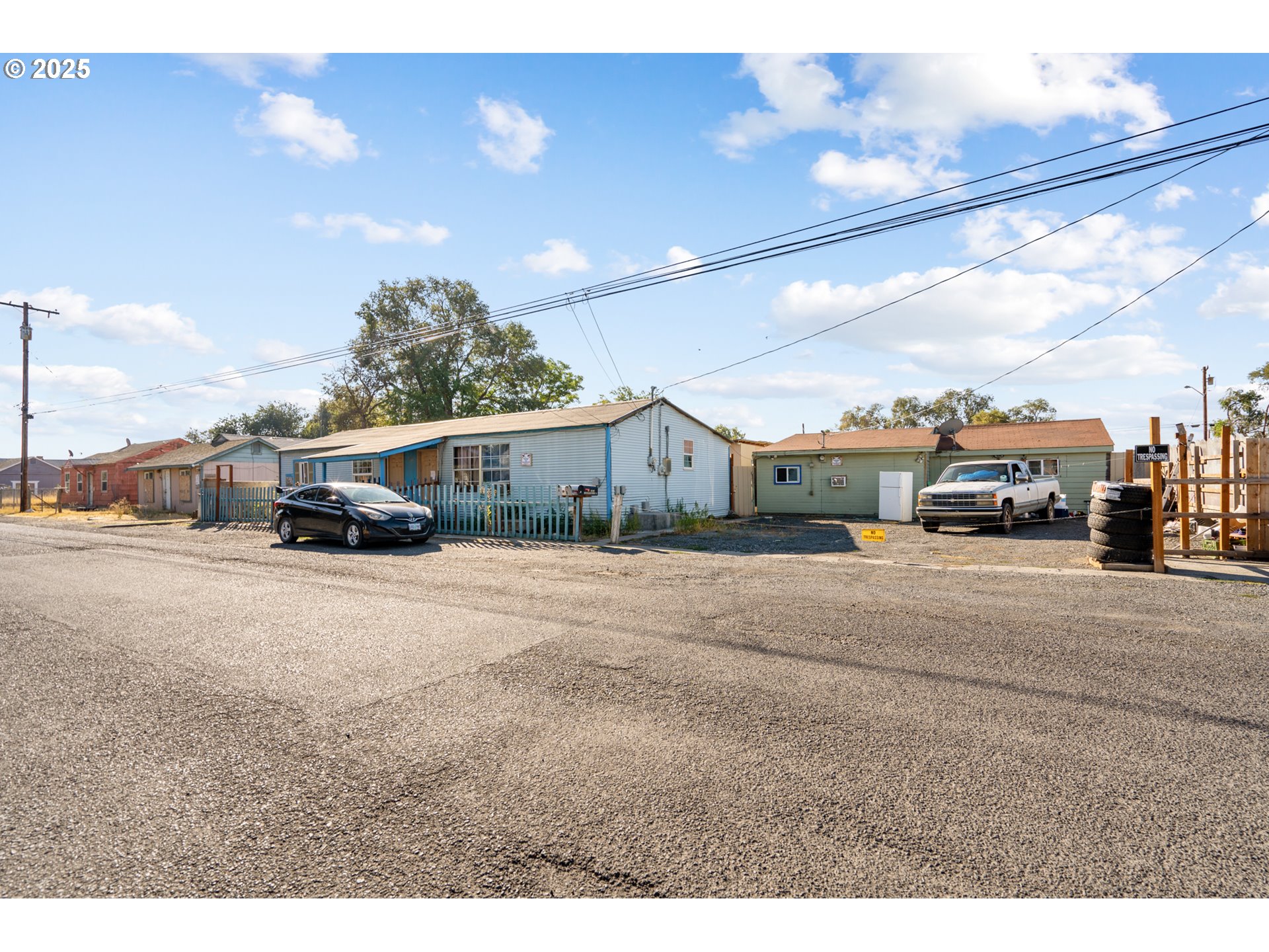 153 West Beech Avenue Hermiston, OR 97838 - Photo 1 of 11 a view of street with parked cars