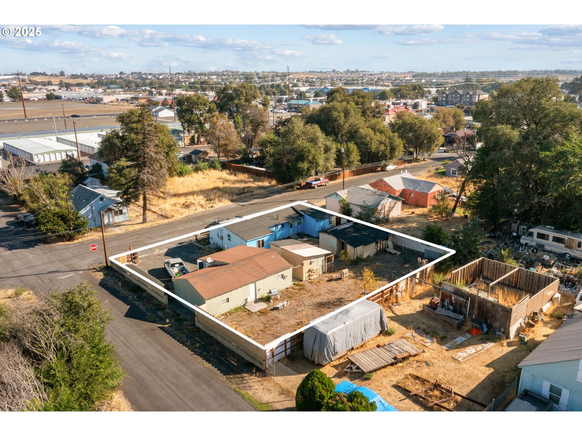 153 West Beech Avenue Hermiston, OR 97838 - Photo 5 of 11 an aerial view of residential houses with outdoor space