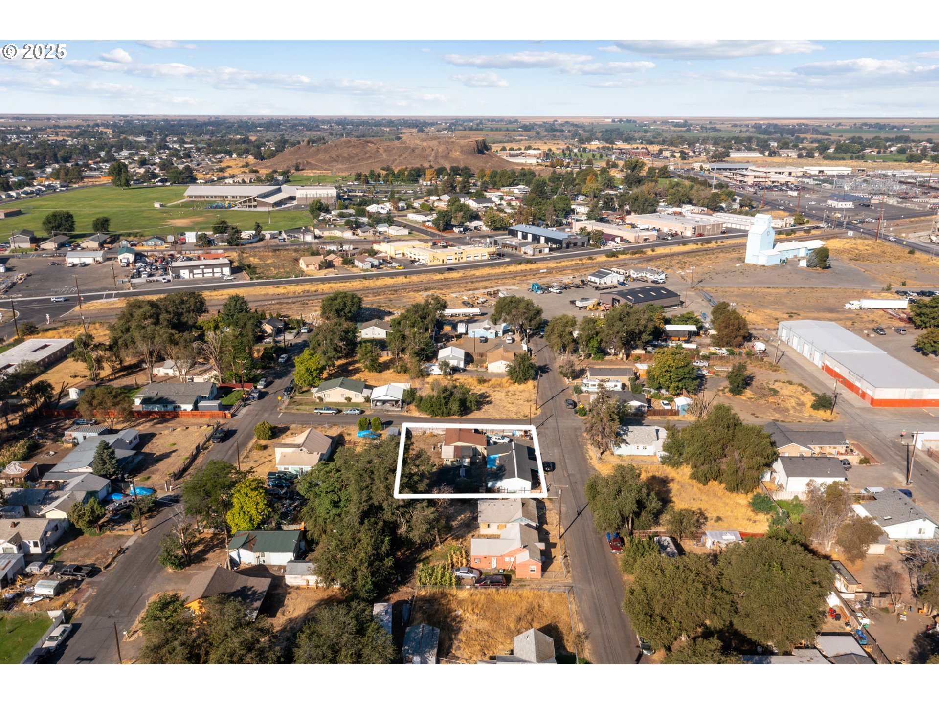 153 West Beech Avenue Hermiston, OR 97838 - Photo 9 of 11 an aerial view of residential building and parking space