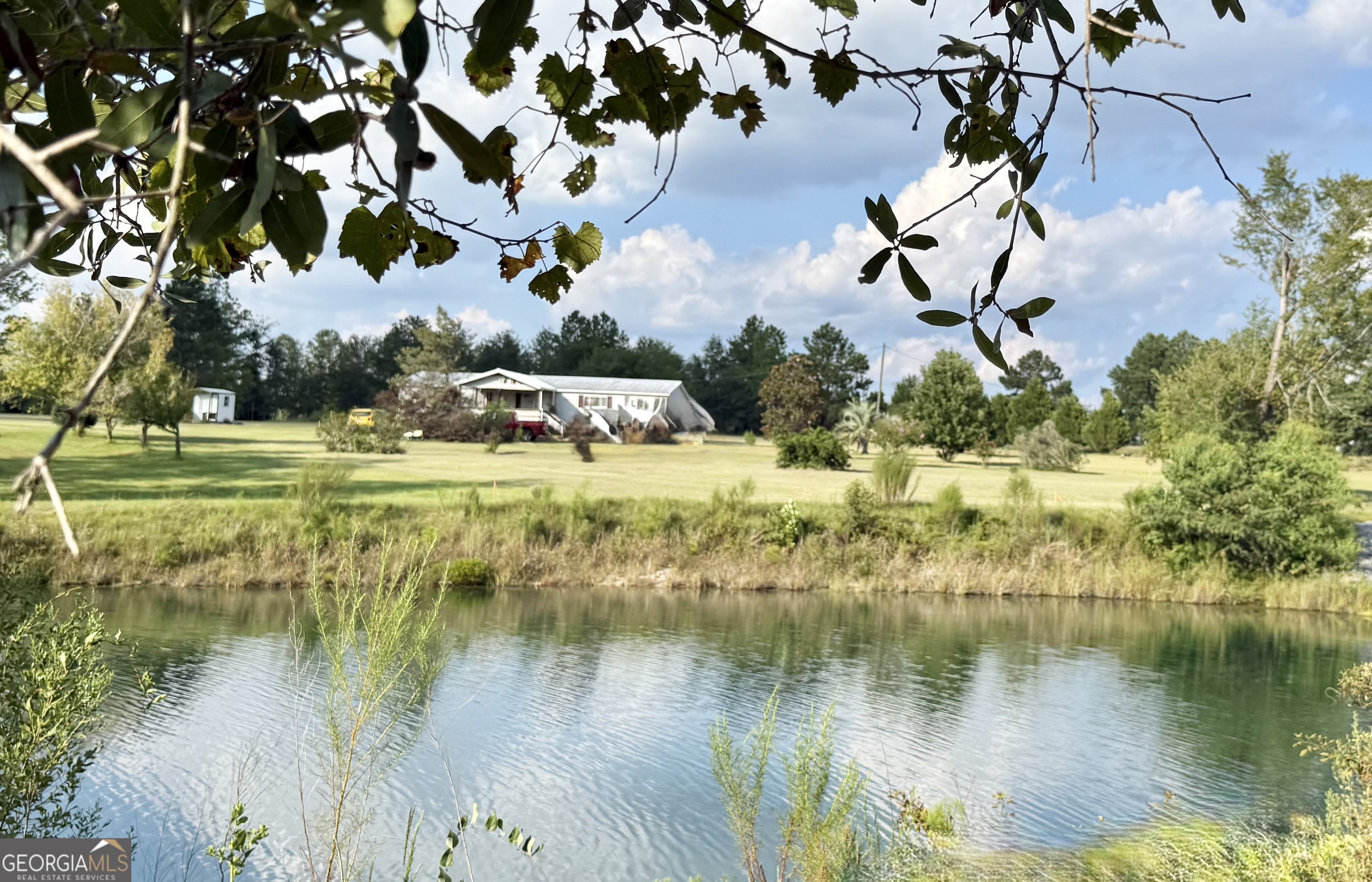 13 Chestnut Road Hazlehurst, GA 31539 - Photo 1 of 1 a view of a lake with houses