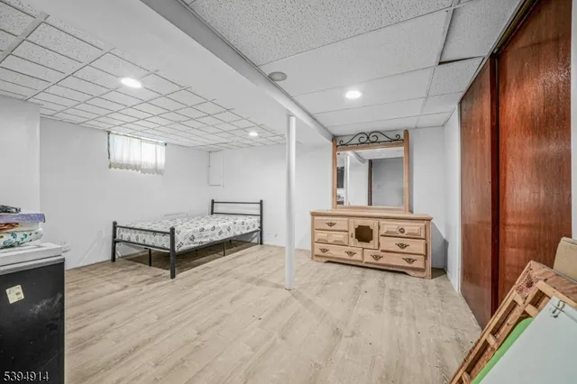 a bedroom with furniture and window