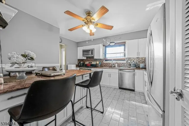 a kitchen with a sink cabinets and window