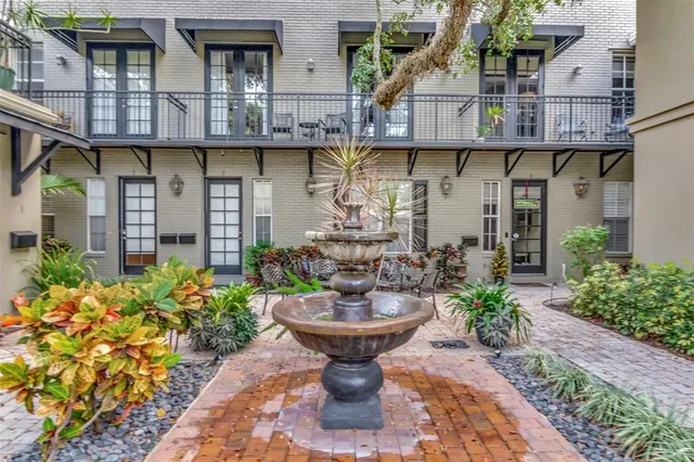 a view of a chair and table in the patio