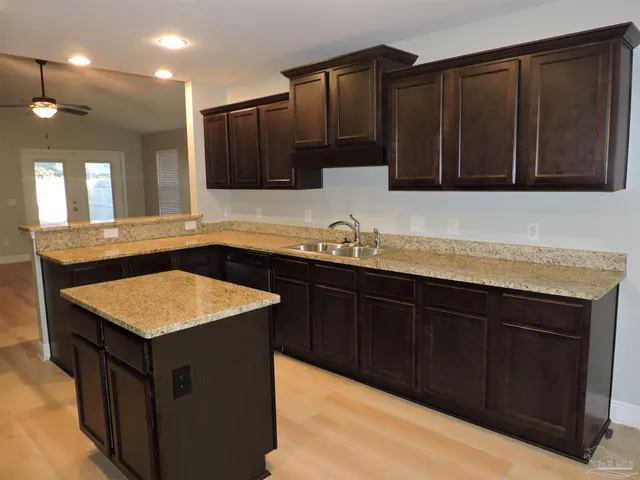 a kitchen with a sink and a stove