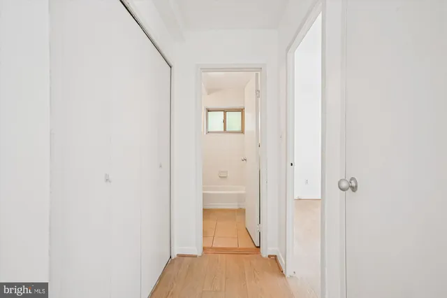 a view of a bathroom from a hallway