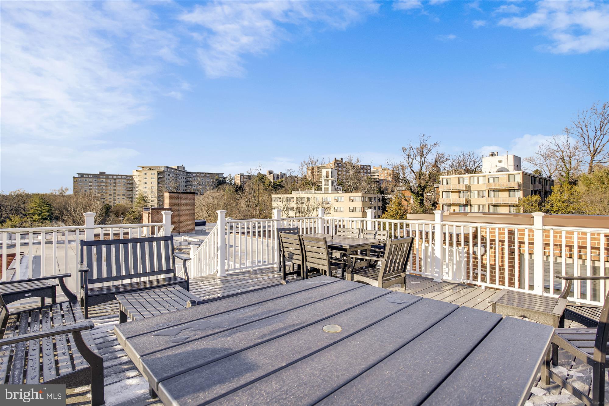 3900 Tunlaw Road Northwest, Unit 509 Washington, DC 20007 - Photo 27 of 36 a view of a balcony with wooden chairs