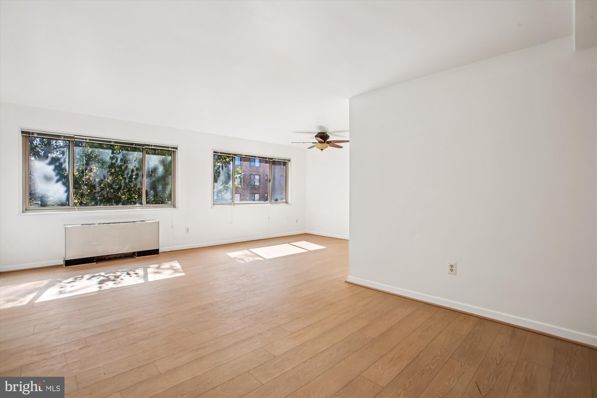 3900 Tunlaw Road Northwest, Unit 509 Washington, DC 20007 - Photo 3 of 36 an empty room with windows