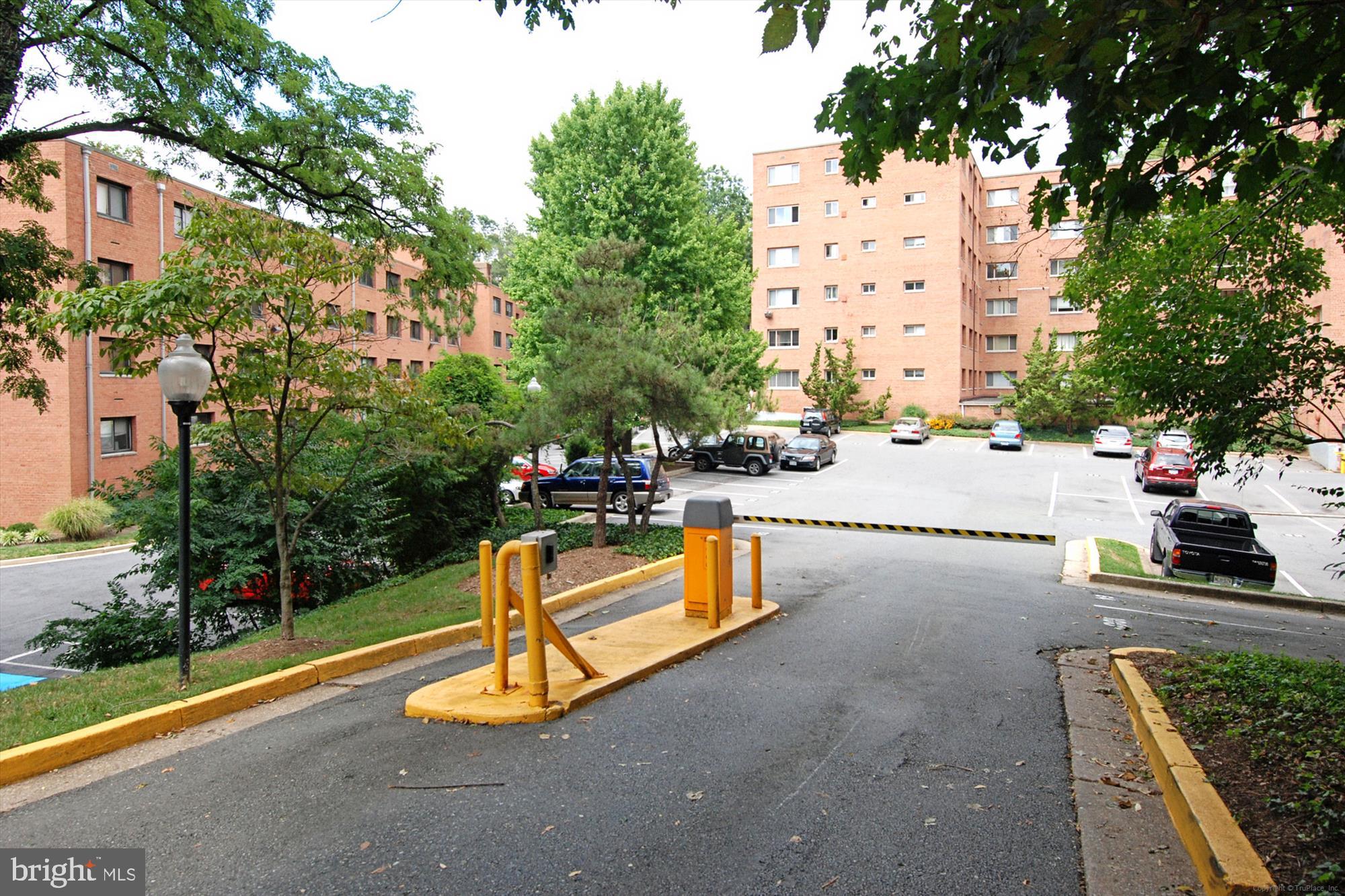 3900 Tunlaw Road Northwest, Unit 509 Washington, DC 20007 - Photo 32 of 36 a view of a swimming pool with a patio
