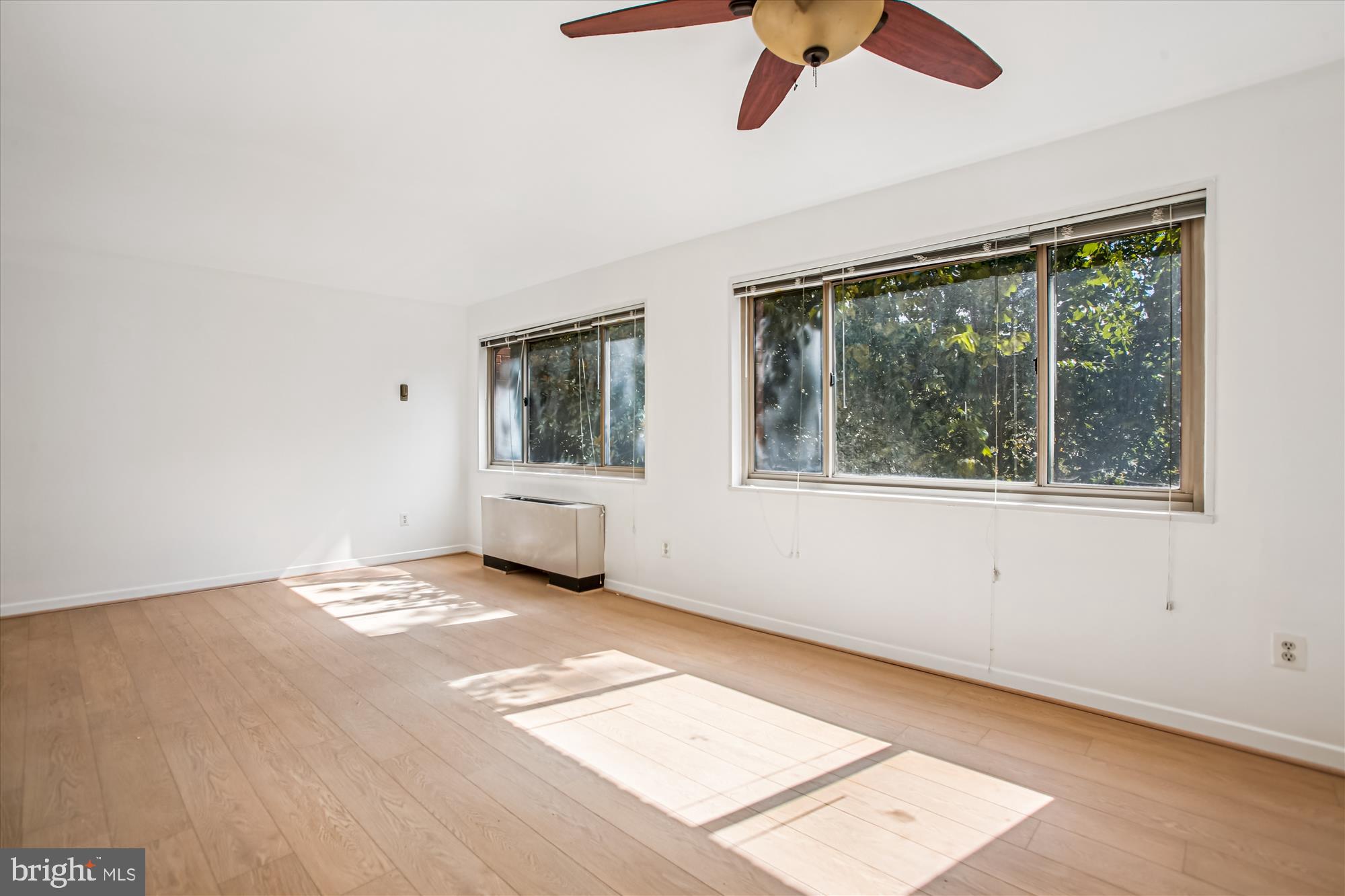 3900 Tunlaw Road Northwest, Unit 509 Washington, DC 20007 - Photo 6 of 36 a view of an empty room with a window