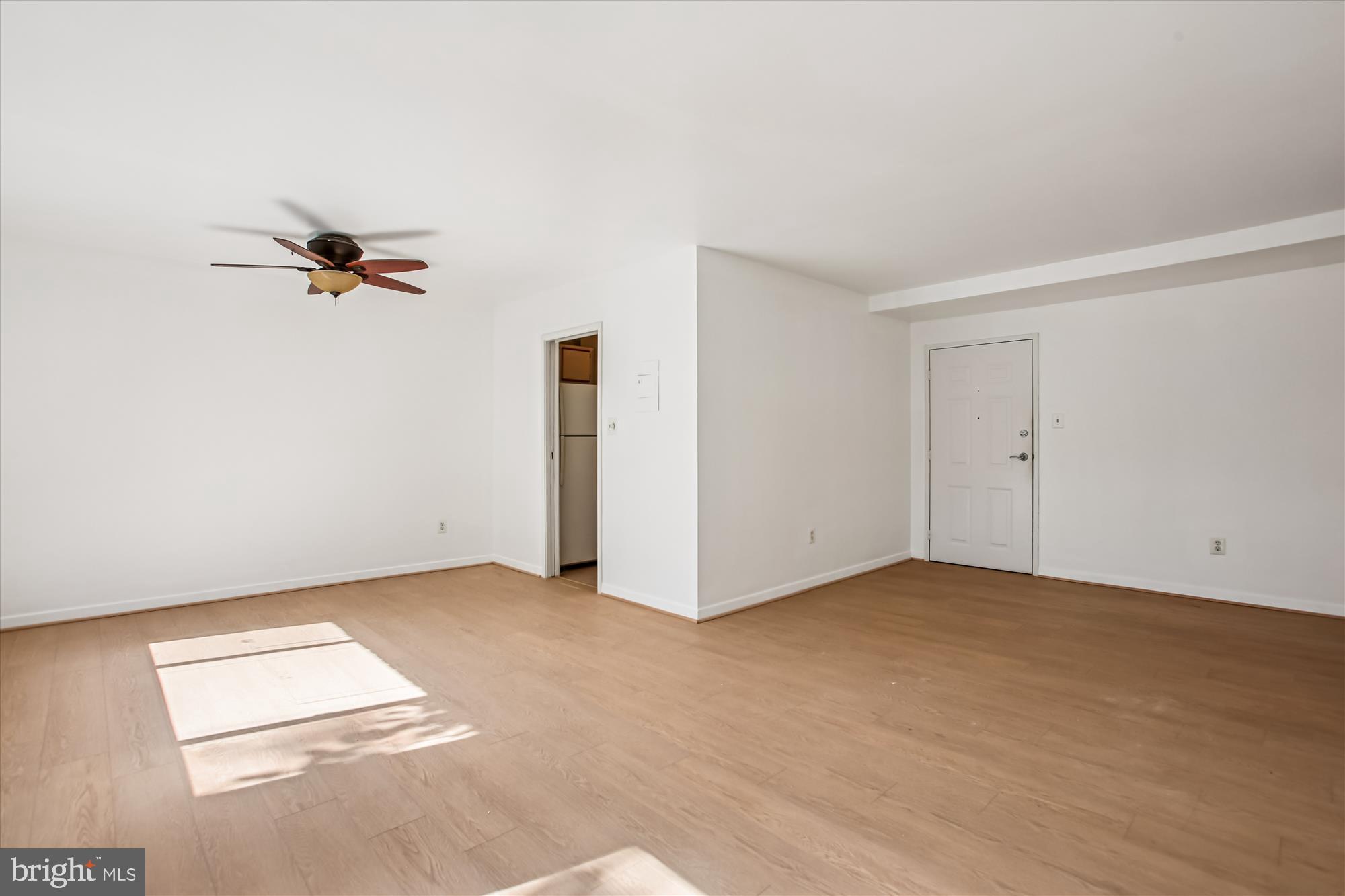 3900 Tunlaw Road Northwest, Unit 509 Washington, DC 20007 - Photo 7 of 36 a view of a room with a ceiling fan and window