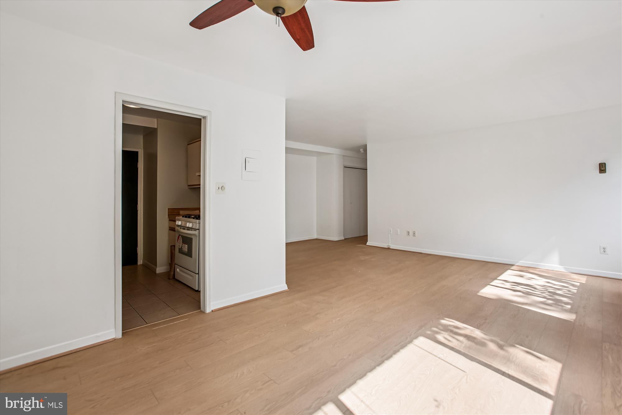 3900 Tunlaw Road Northwest, Unit 509 Washington, DC 20007 - Photo 8 of 36 an empty room with view of ceiling fan