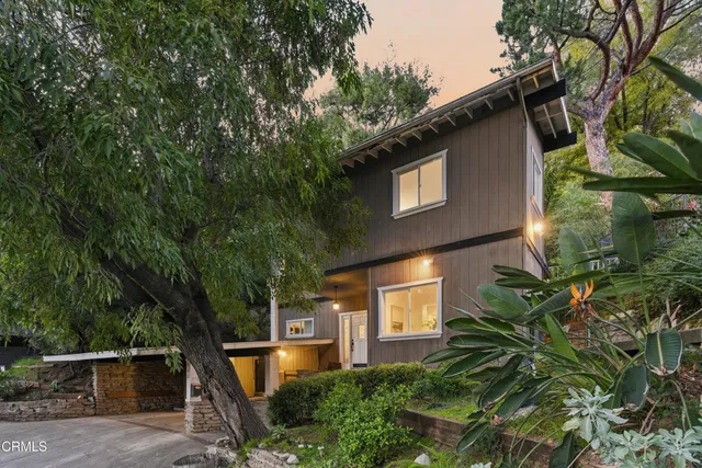 a front view of a house with yard