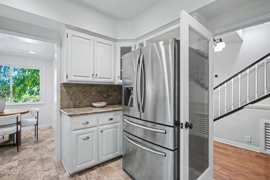 640 Chaparral Road Sierra Madre, CA 91024 - Photo 11 of 25 a kitchen with white cabinets and white appliances