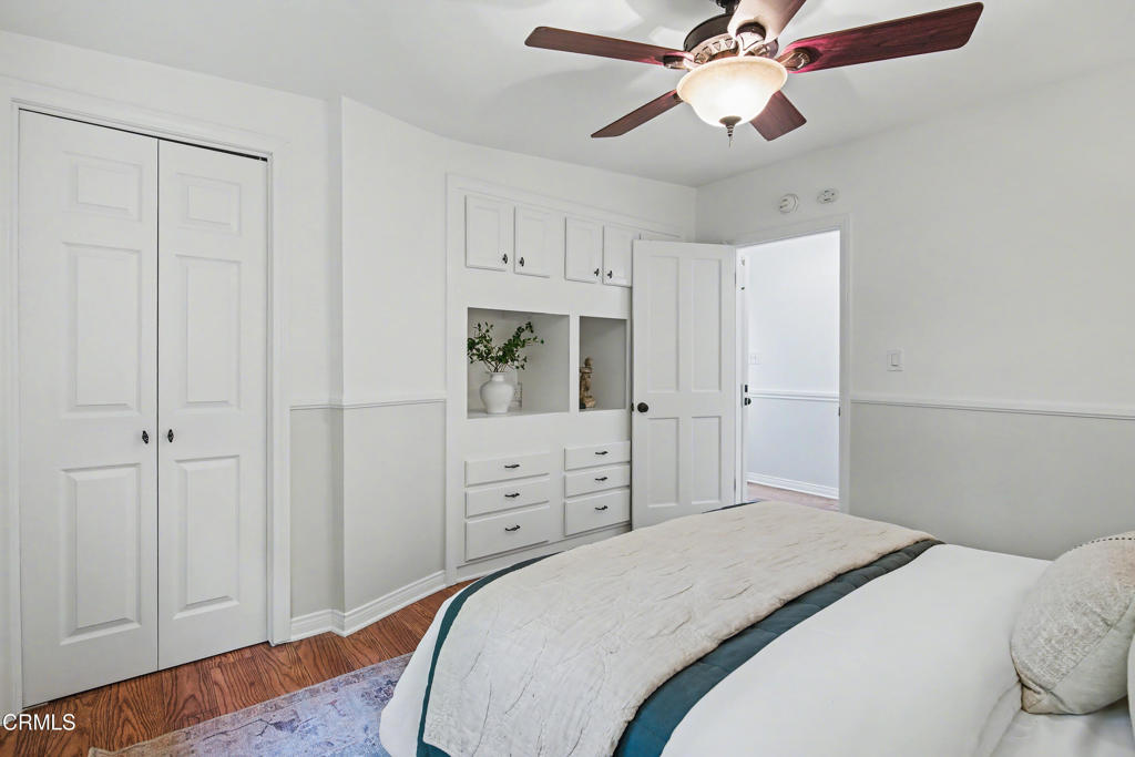 640 Chaparral Road Sierra Madre, CA 91024 - Photo 13 of 25 a bedroom with a bed and a chandelier