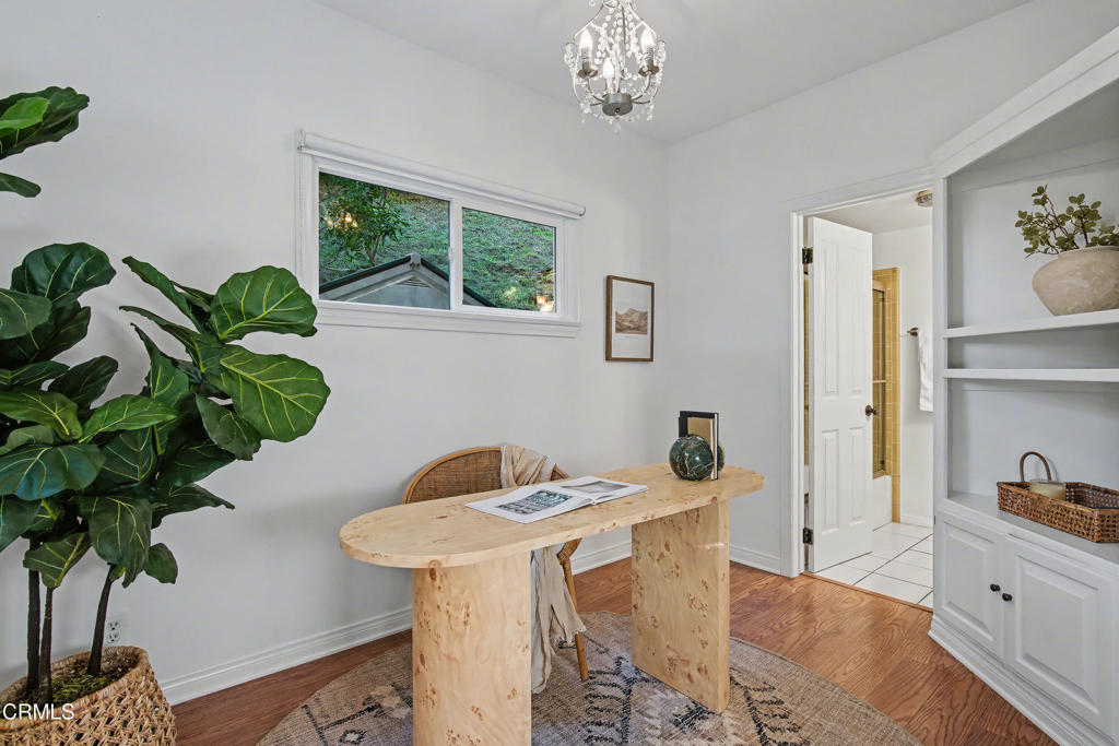 640 Chaparral Road Sierra Madre, CA 91024 - Photo 17 of 25 a dining room with furniture potted plants and wooden floor