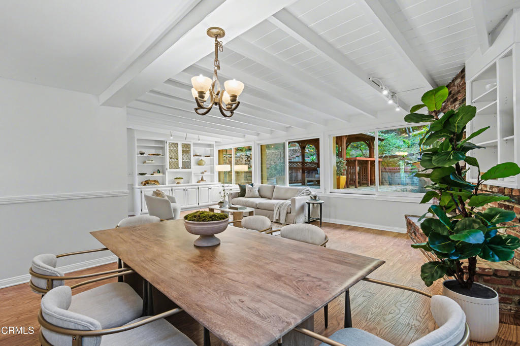 640 Chaparral Road Sierra Madre, CA 91024 - Photo 7 of 25 a view of a dining room with furniture wooden floor and chandelier