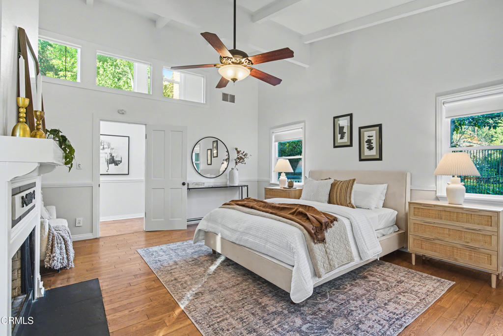 640 Chaparral Road Sierra Madre, CA 91024 - Photo 9 of 25 a bedroom with a bed and a chandelier