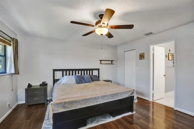 a bed room with a bed and a chandelier