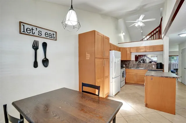 a view of kitchen and dining area with furniture