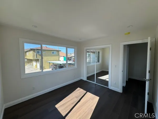 a living room with a bed furniture and a window