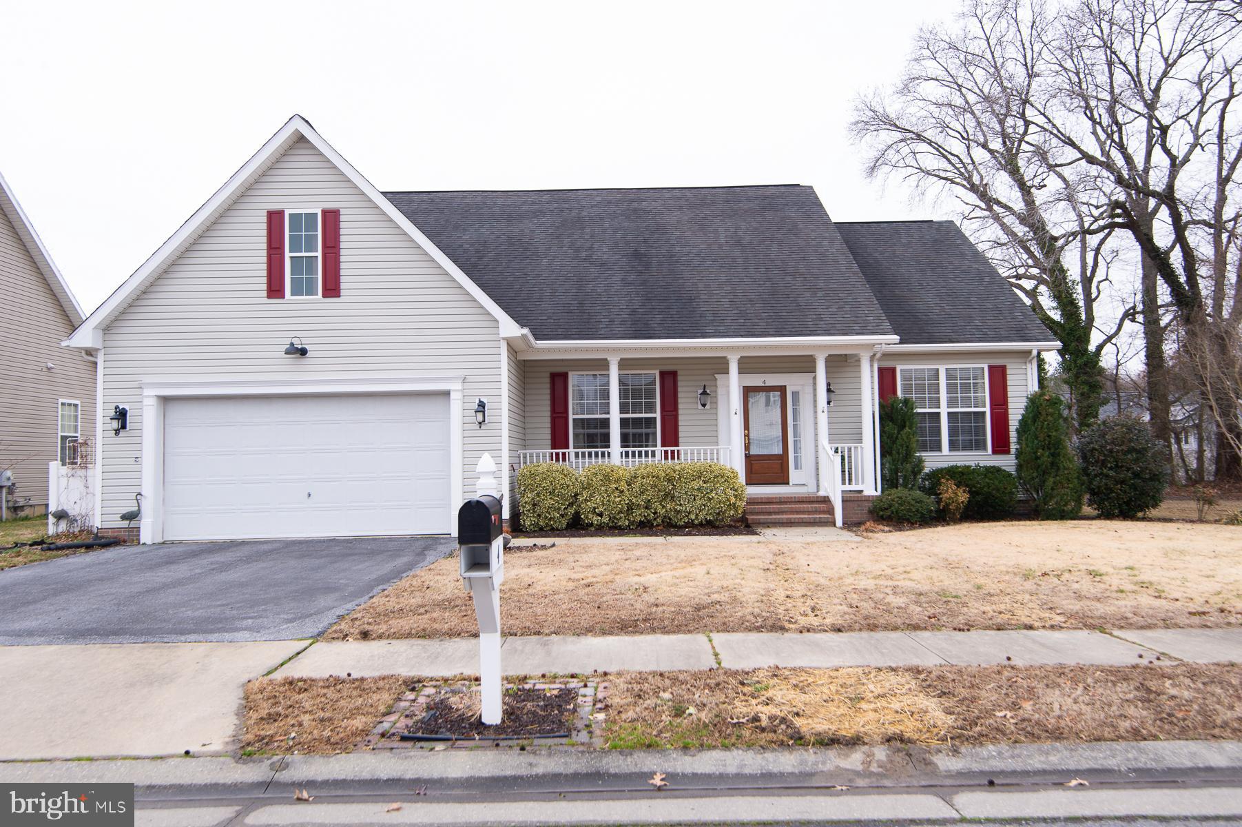 4 Mimosa Court Cambridge, MD 21613 - Photo 1 of 1 a front view of a house with a yard