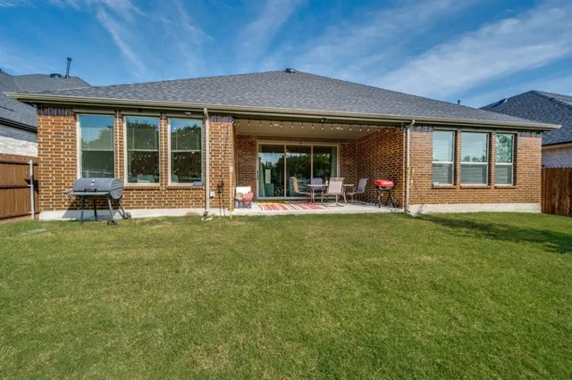 a front view of a house with a garden and porch