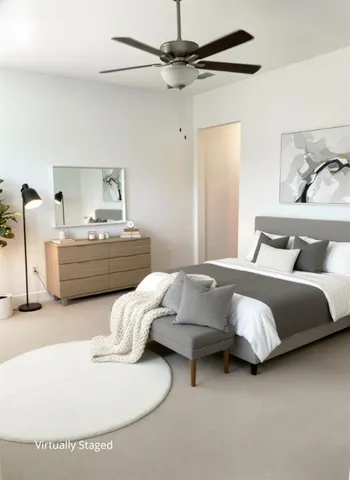 a bedroom with bed and window