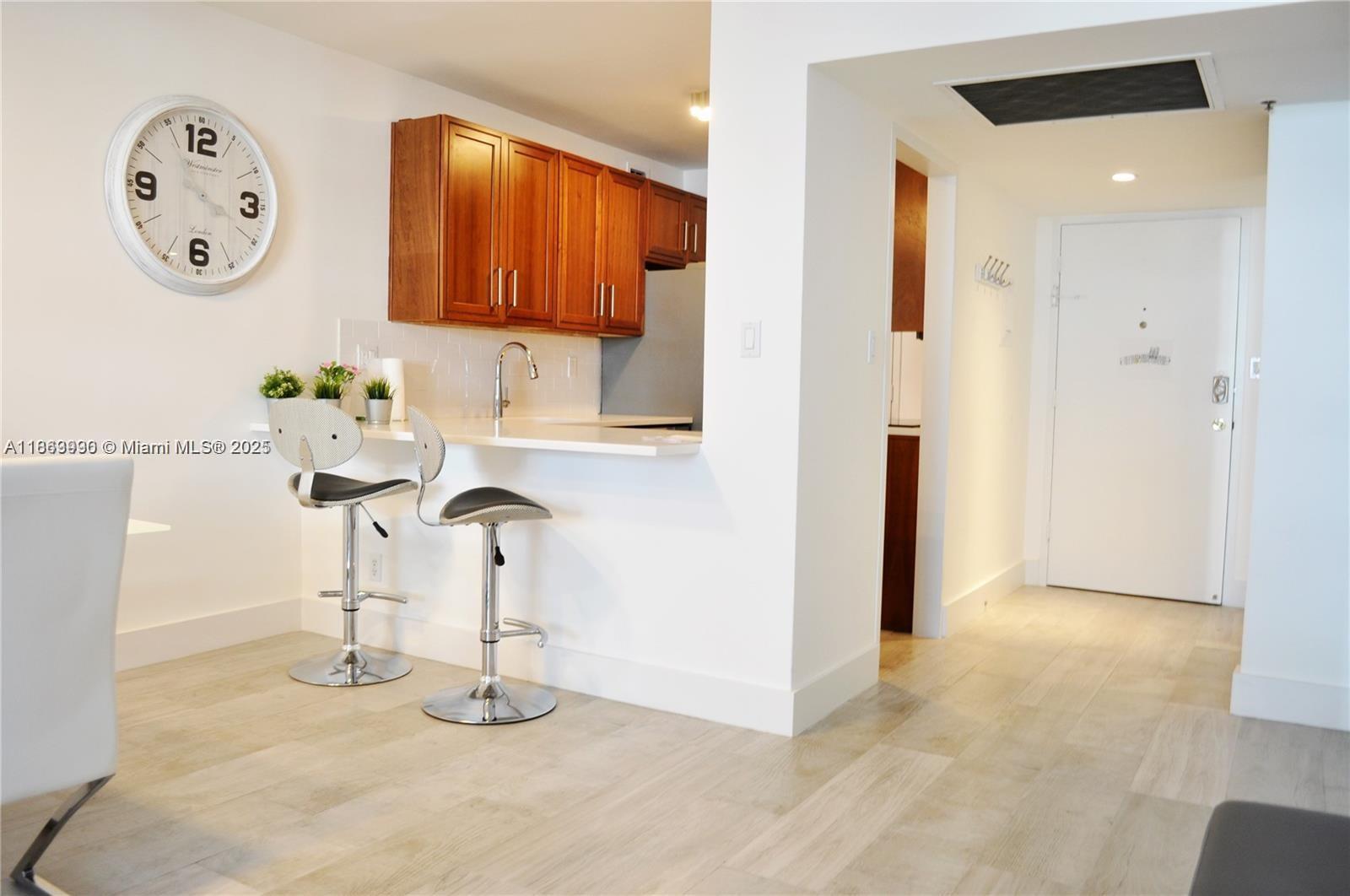 100 Lincoln Road, Unit 435 Miami Beach, FL 33139 - Photo 3 of 9 a bathroom with a sink and a mirror