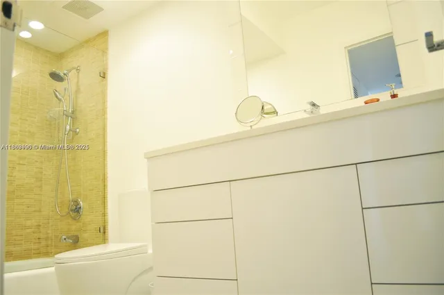 a bathroom with a tub and shower