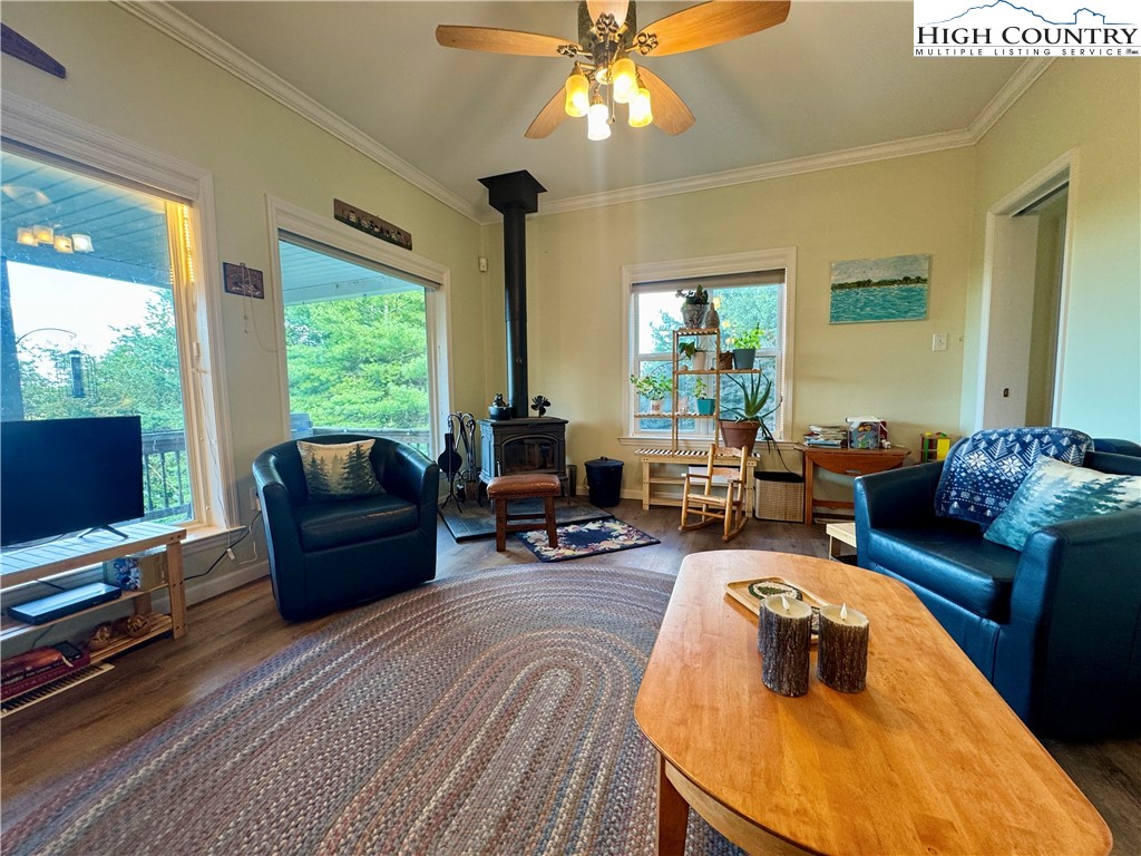 449 Meadow Ridge Drive Jefferson, NC 28640 - Photo 11 of 40 a living room with furniture and a fireplace