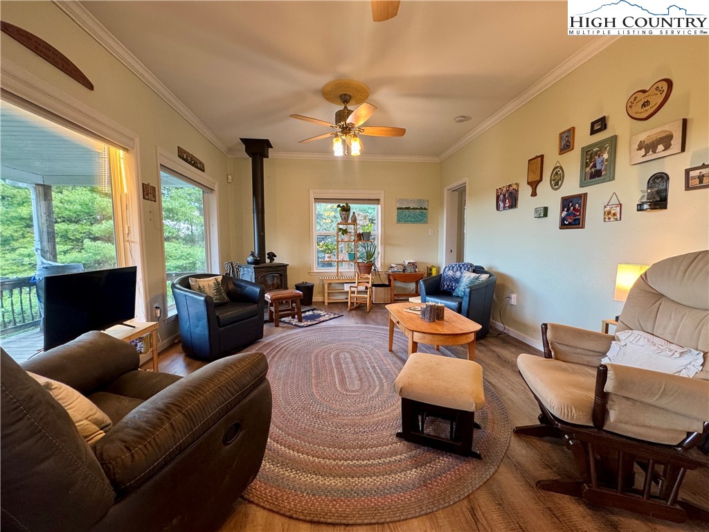 449 Meadow Ridge Drive Jefferson, NC 28640 - Photo 12 of 40 a living room with furniture flower pot and a large window