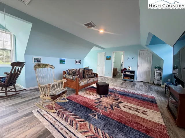 a spacious bathroom with a double vanity sink and a mirror