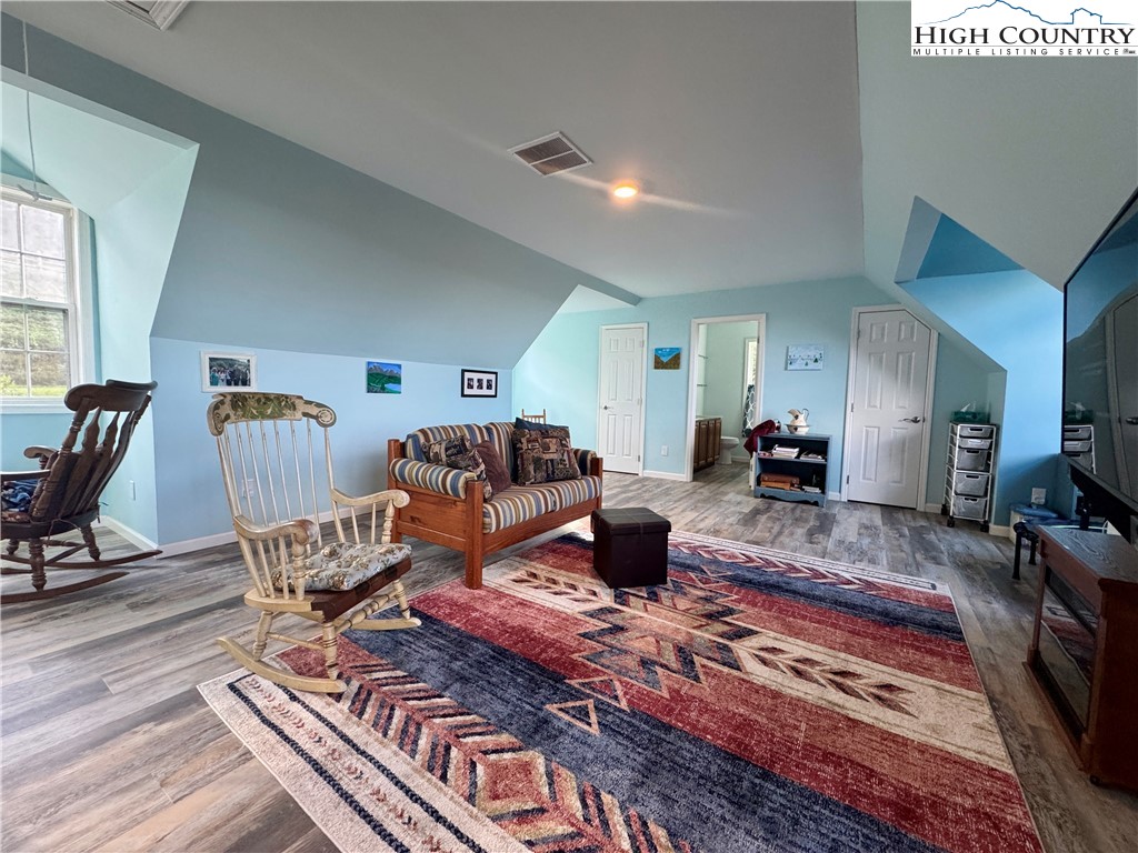 449 Meadow Ridge Drive Jefferson, NC 28640 - Photo 24 of 40 a living room with furniture rug and a window