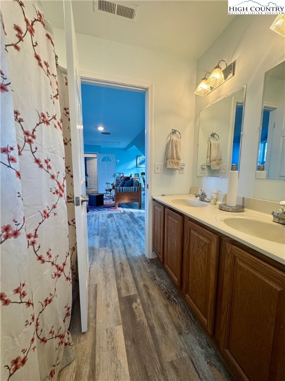 449 Meadow Ridge Drive Jefferson, NC 28640 - Photo 25 of 40 a spacious bathroom with a double vanity sink and a mirror