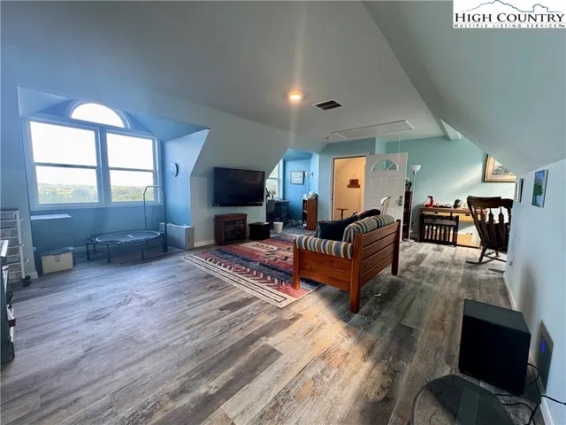 a view of balcony with furniture