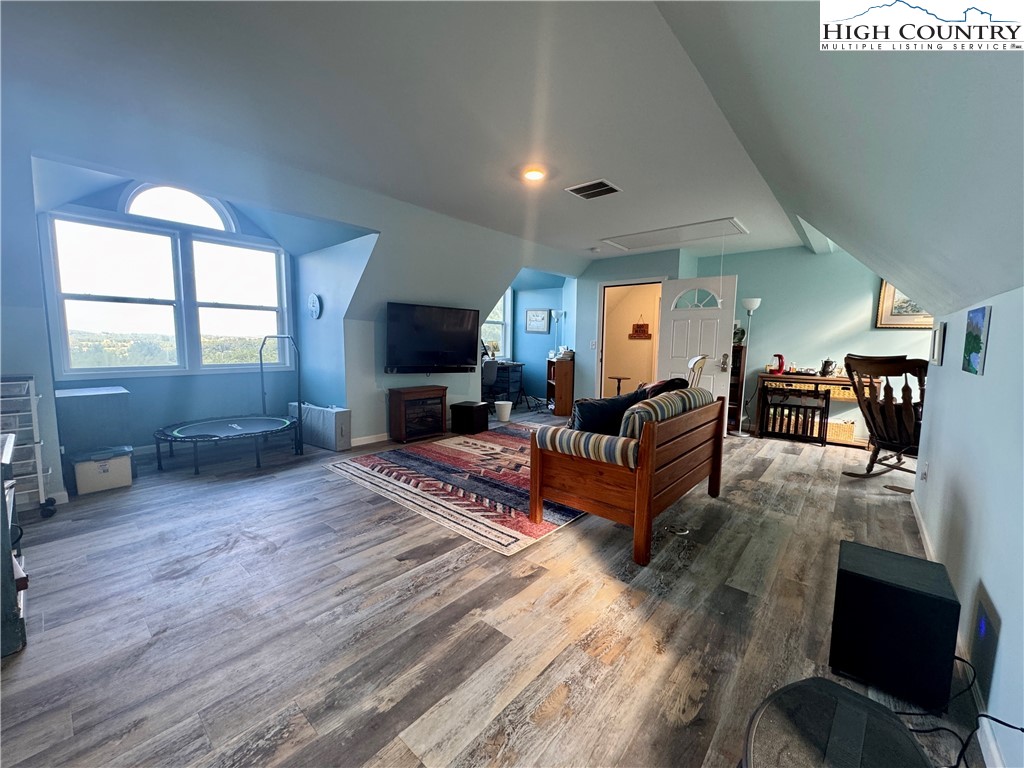 449 Meadow Ridge Drive Jefferson, NC 28640 - Photo 27 of 40 a living room with furniture and a flat screen tv