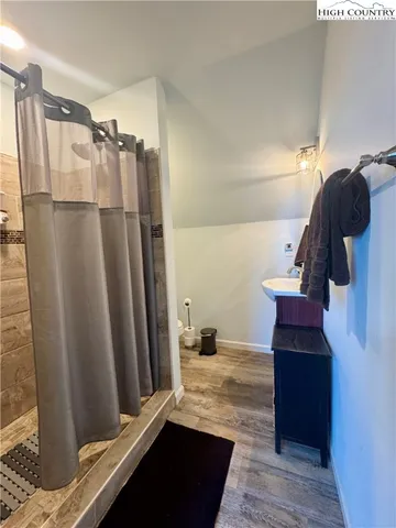 a view of a chairs and table in the balcony