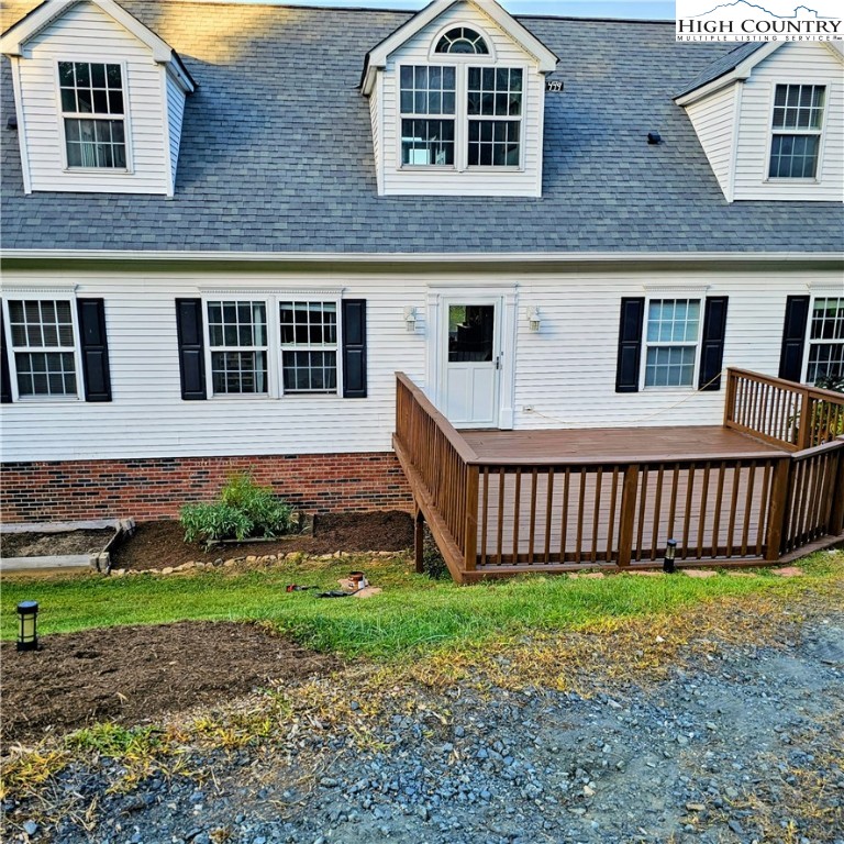 449 Meadow Ridge Drive Jefferson, NC 28640 - Photo 4 of 40 a front view of a house with a yard