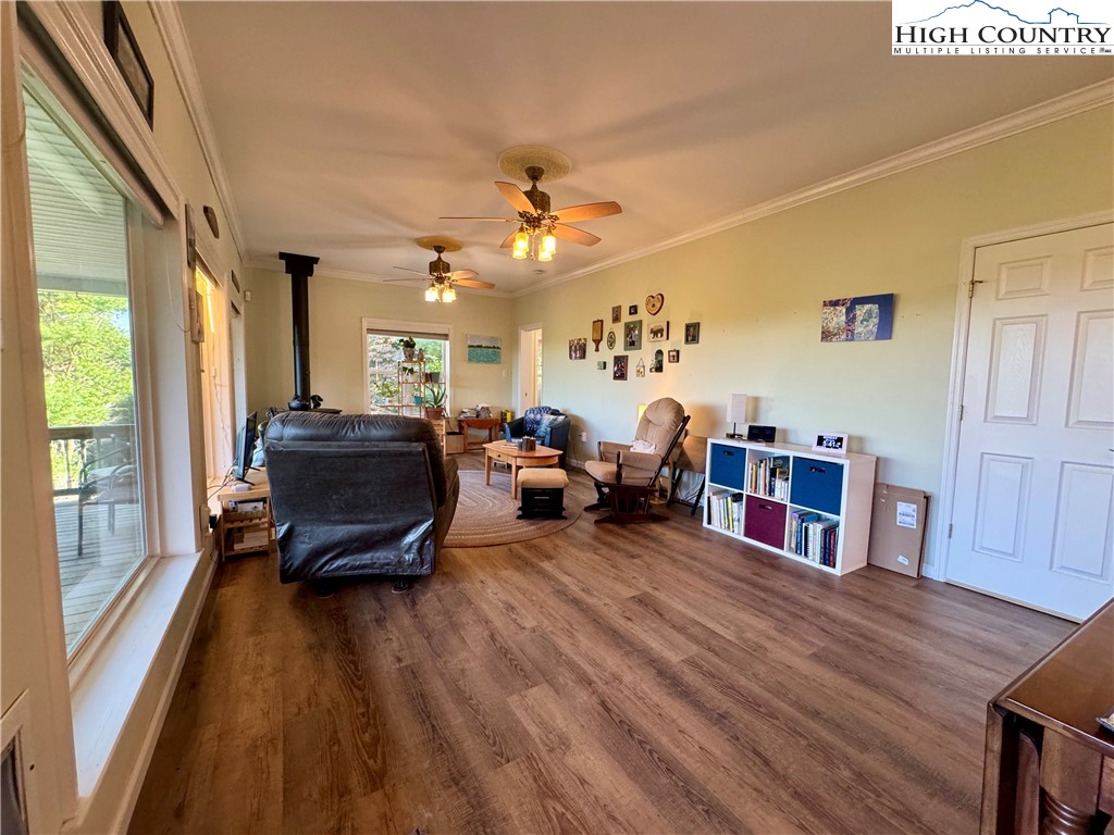449 Meadow Ridge Drive Jefferson, NC 28640 - Photo 8 of 40 a living room with furniture and a large window