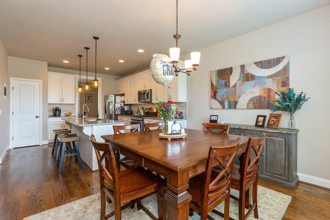 3501 Earhart Road Mount Juliet, TN 37122 - Photo 16 of 42 a view of a dining room and livingroom with furniture wooden floor a chandelier
