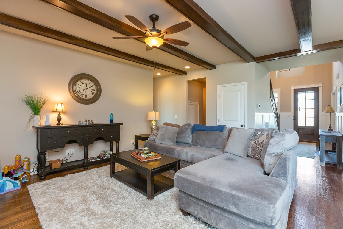 3501 Earhart Road Mount Juliet, TN 37122 - Photo 18 of 42 a living room with furniture a clock and a fireplace