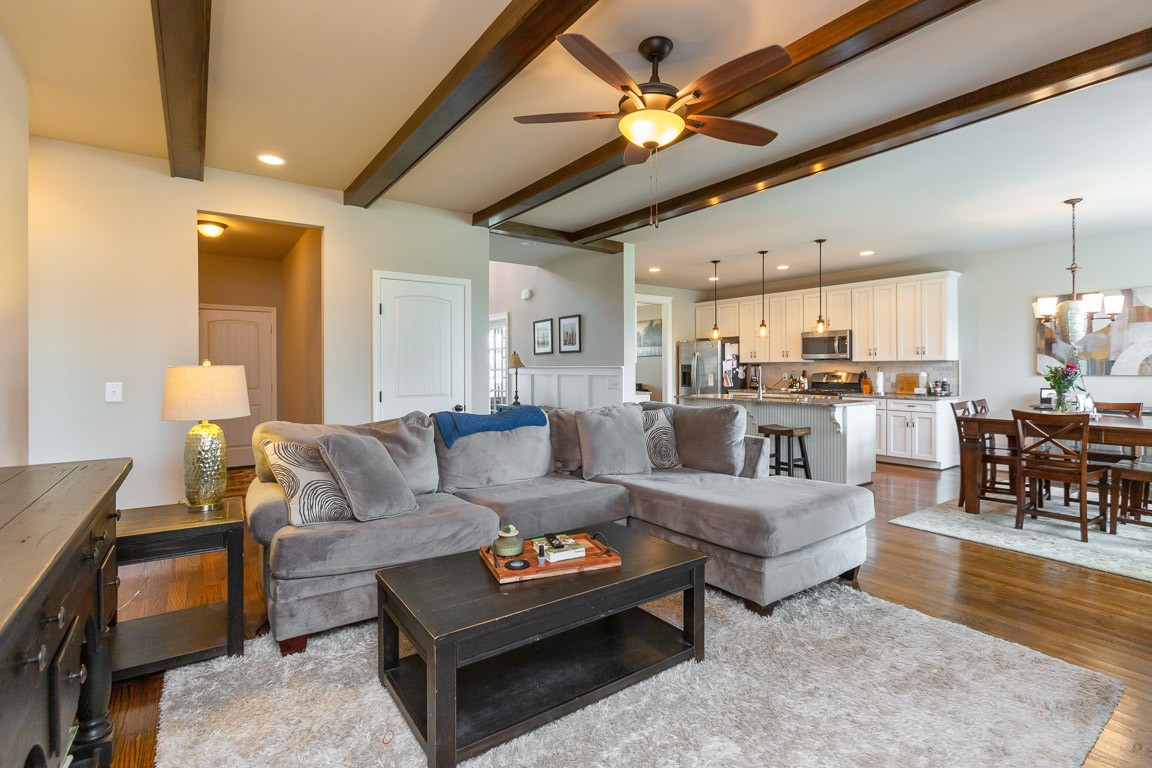 3501 Earhart Road Mount Juliet, TN 37122 - Photo 19 of 42 a living room with furniture kitchen view and a chandelier