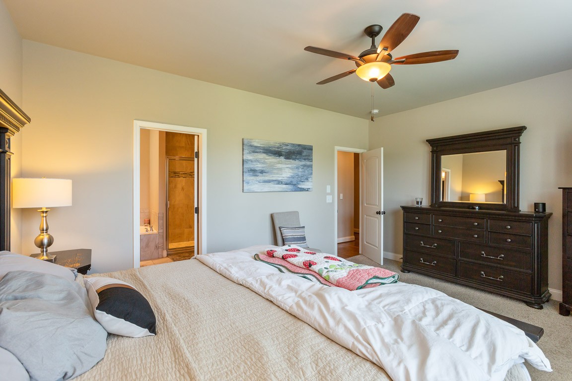 3501 Earhart Road Mount Juliet, TN 37122 - Photo 25 of 42 a bedroom with a bed and a tv on dresser