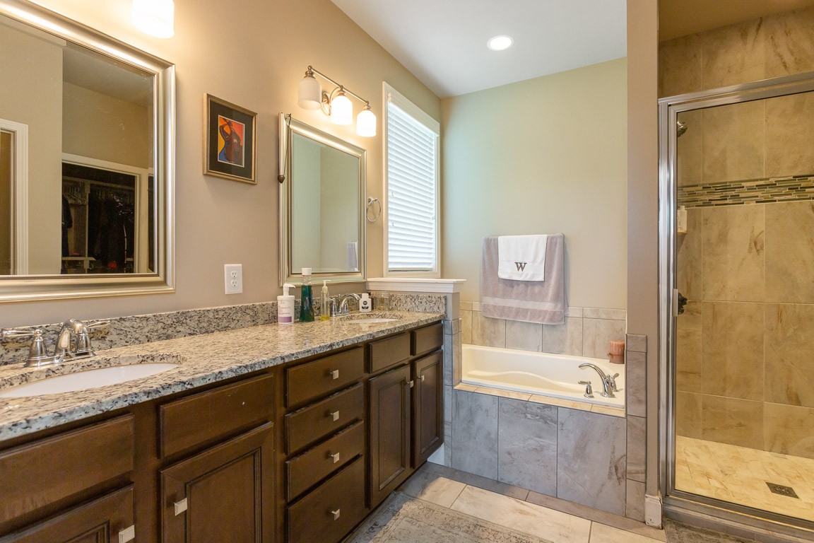 3501 Earhart Road Mount Juliet, TN 37122 - Photo 27 of 42 a bathroom with a granite countertop sink mirror and a bathtub