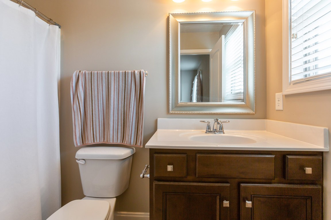 3501 Earhart Road Mount Juliet, TN 37122 - Photo 35 of 42 a bathroom with a sink a toilet and a mirror
