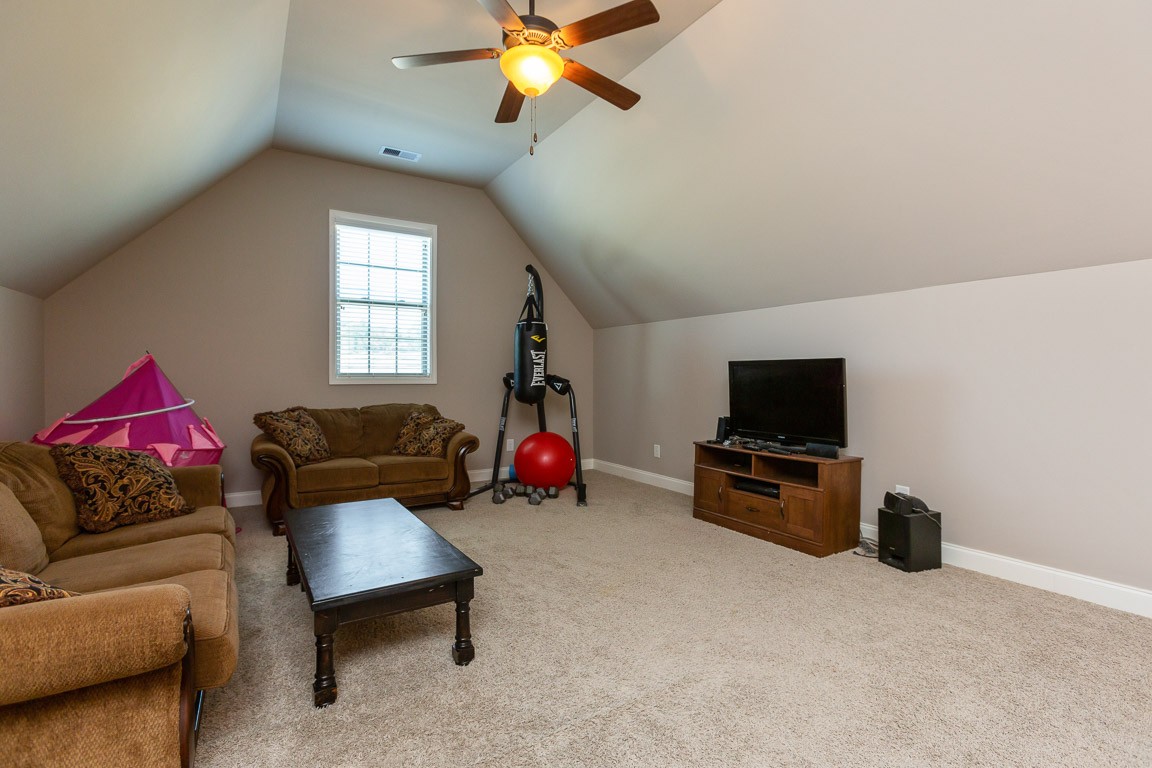 3501 Earhart Road Mount Juliet, TN 37122 - Photo 36 of 42 a living room with furniture and a flat screen tv