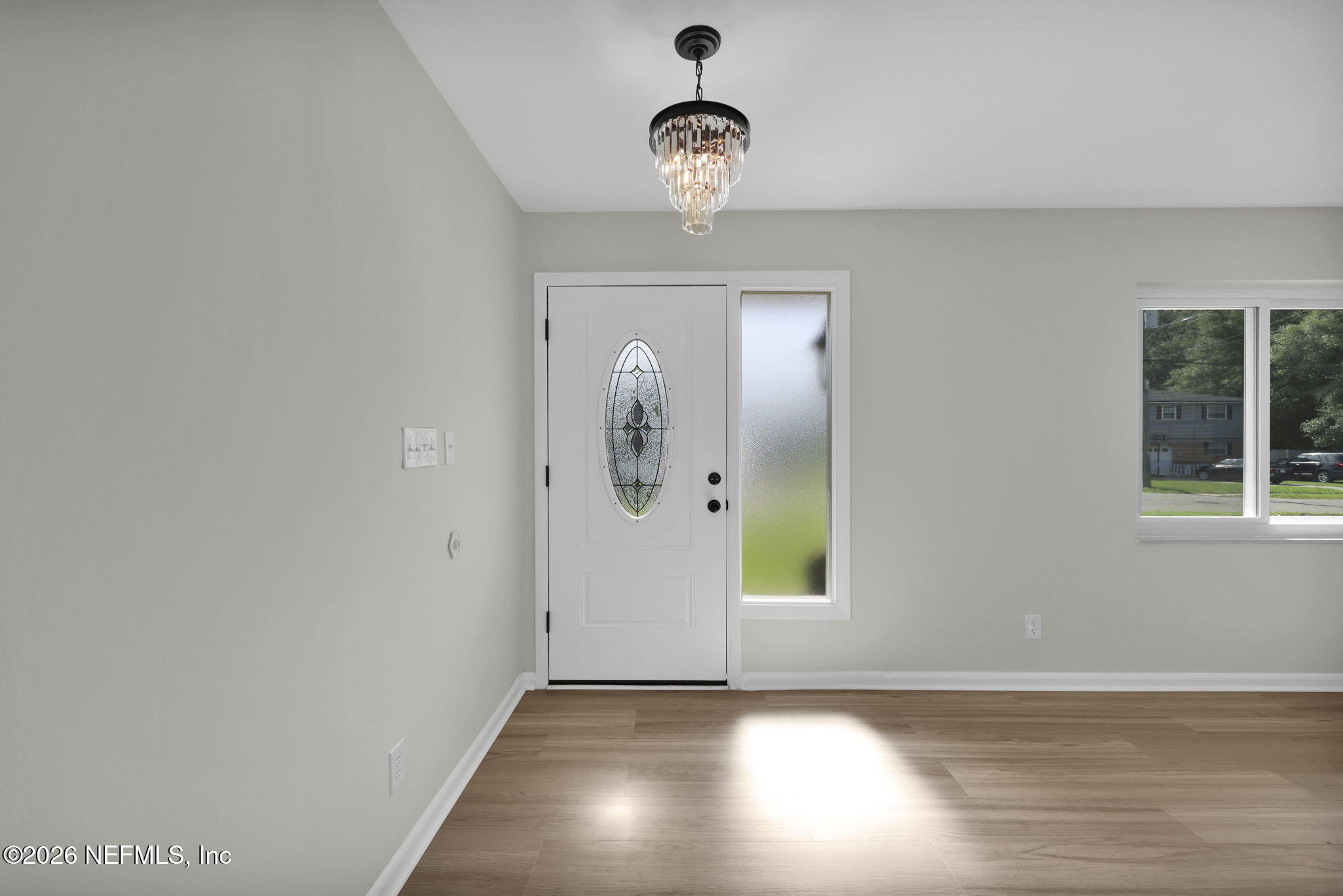 8544 Sanchez Road Jacksonville, FL 32217 - Photo 8 of 46 a view of a livingroom with wooden floor and a window