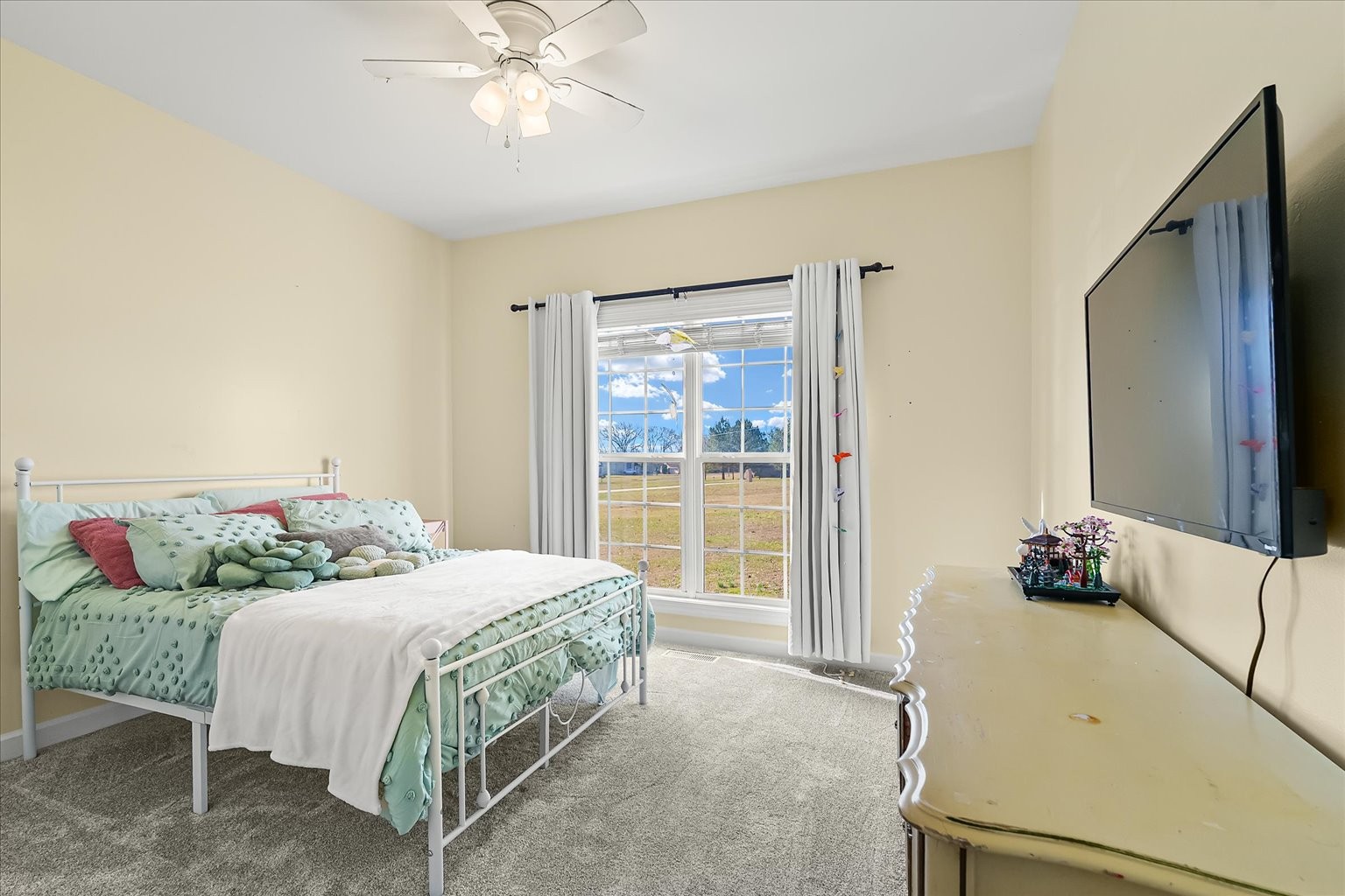 140 Glider Loop Eagleville, TN 37060 - Photo 12 of 39 a bedroom with a bed and a chandelier