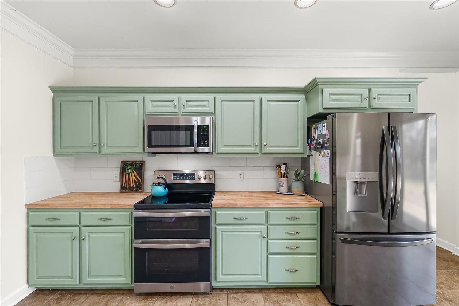 140 Glider Loop Eagleville, TN 37060 - Photo 18 of 39 a kitchen with a refrigerator and a stove top oven